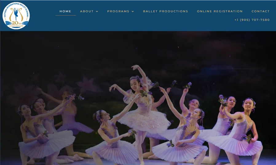Victoria Ballet homepage with academy navigation and a ballet performance photograph.